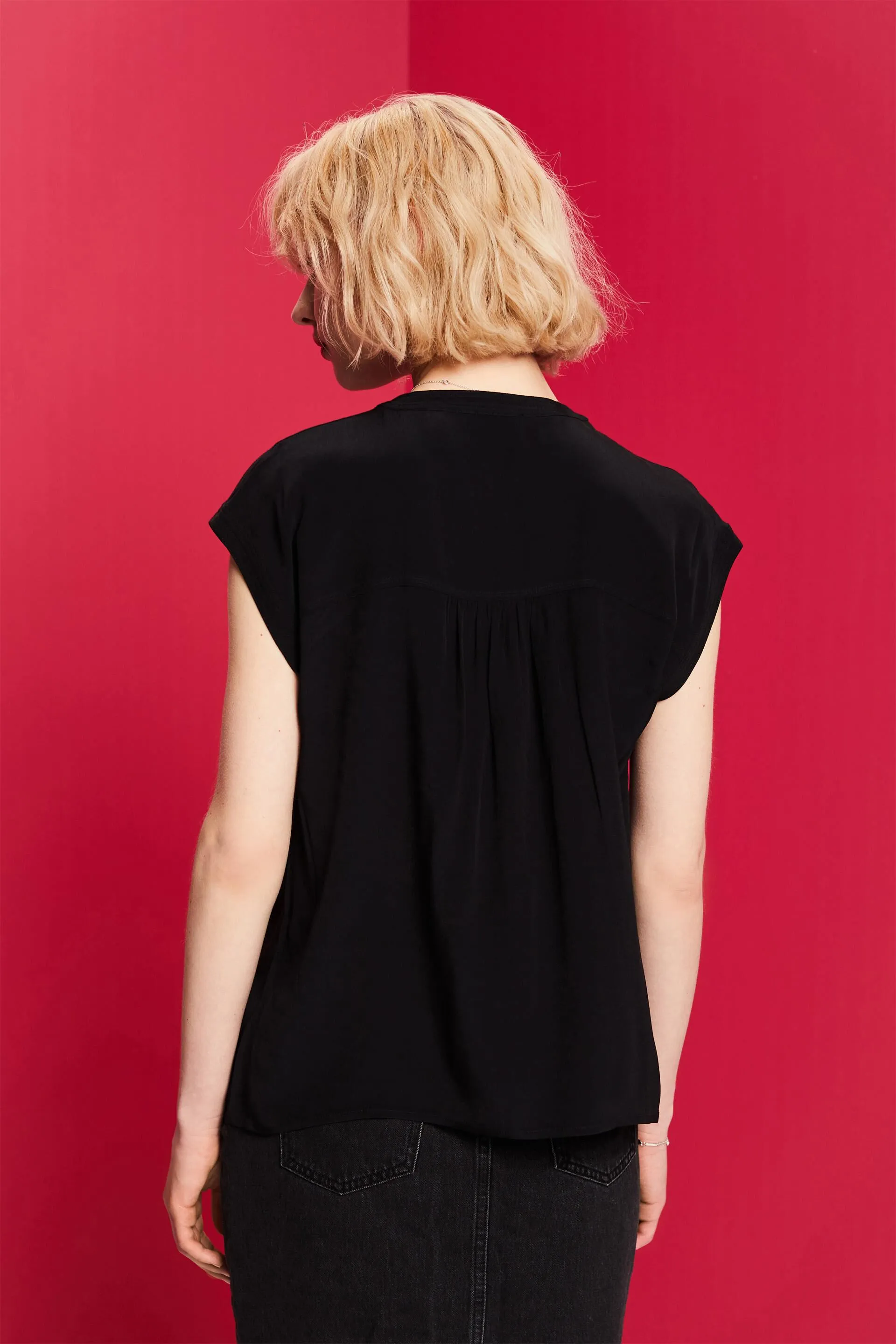 Blusa con bottone davanti